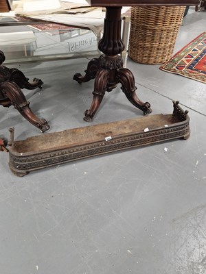 Lot 390 - A cast iron fire fender