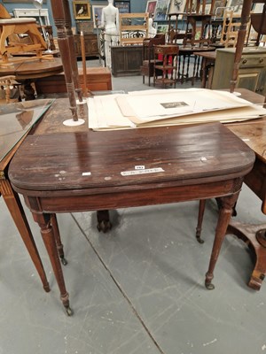 Lot 393 - A 19th century mahogany fold over card table...