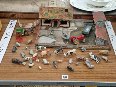 Lot 682 - A wooden farm yard, a Dinky toy tractor, a...