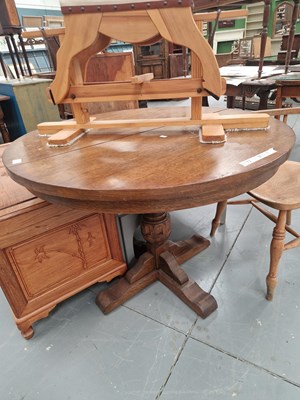 Lot 400 - A vintage oak extending pedestal dining table,...