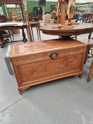 Lot 402 - An eastern carved hardwood coffer on bracket...