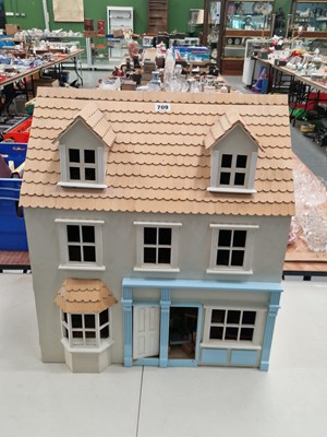 Lot 709 - A shingle roofed three storey dolls house,...