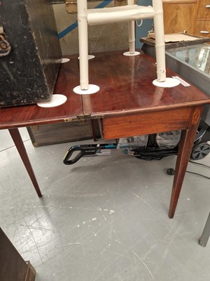 Lot 411 - A George III mahogany foldover tea table with...