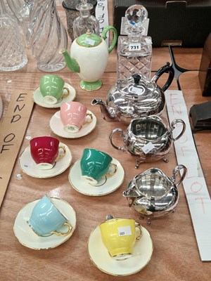 Lot 731 - An electroplate three piece tea set, a spirit...