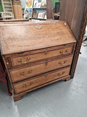Lot 418 - A Georgian crossbanded oak bureau, the fitted...