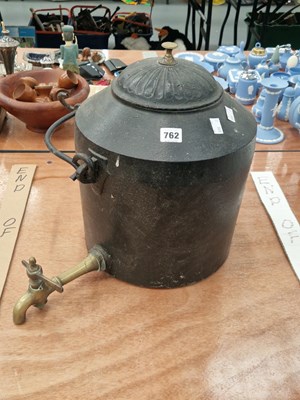 Lot 762 - A cast iron kettle with a brass spigot made...
