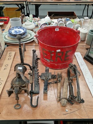 Lot 767 - A 'Fire' bucket, traps, a table clamping...
