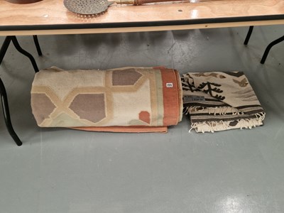 Lot 771 - A machine made rug, together with another rug