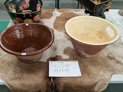Lot 775 - Two terracotta dairy bowls, one glazed over...
