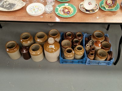 Lot 783 - A collection of two tone stone ware jars and...