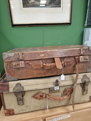 Lot 441 - A canvas and leather suitcase with travel...