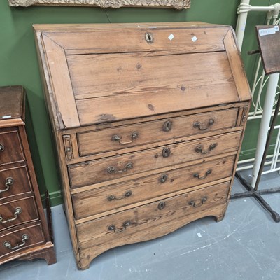 Lot 448 - An antique pine bureau, the multi draw fitted...