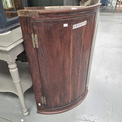 Lot 455 - A Georgian oak bow front corner cabinet H 88 W...