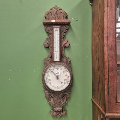 Lot 459 - An antique aneroid banjo barometer with a...