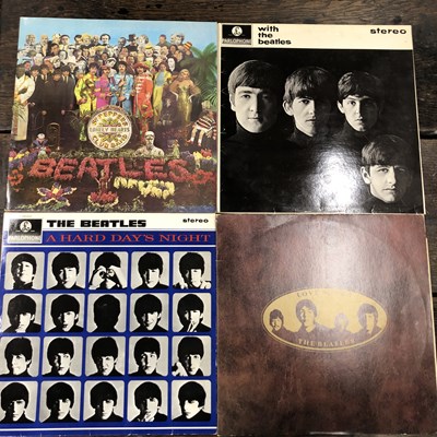 Lot 2935 - The Beatles - four LP records; Sgt. Pepper '83...
