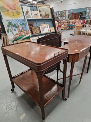 Lot 230 - An Edwardian mahogany tea trolley with a...