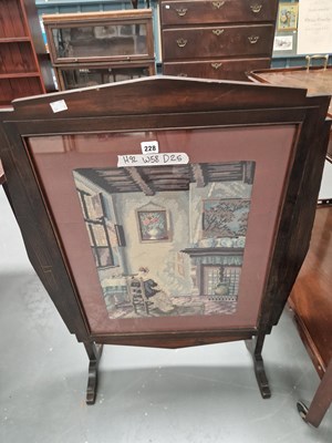 Lot 228 - An early 1900s fire screen set with a needwork...