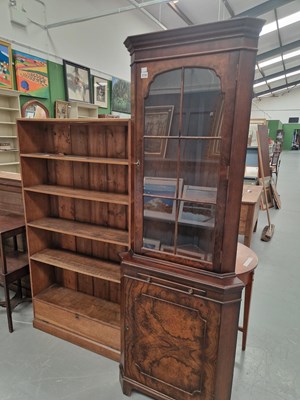 Lot 219 - A vintage walnut corner library cabinet, the...