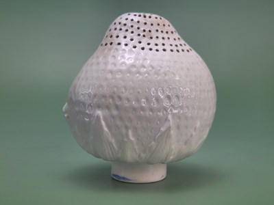 Lot 1869 - A European white glazed pottery strawberry...