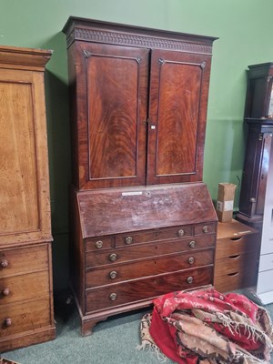 Lot 6 - A George III mahogany bureau bookcase, a blind...