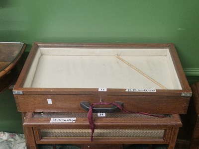 Lot 12 - A glazed oak table top display cabinet lined...