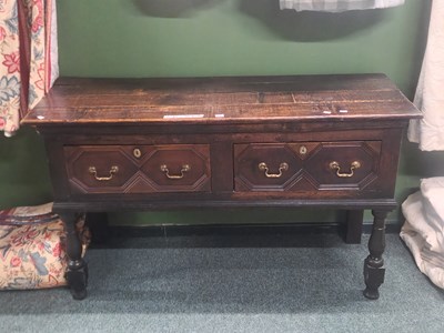 Lot 17 - An oak dresser with the brass handles to the...
