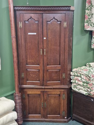 Lot 18 - A George III oak corner cupboard, the upper...