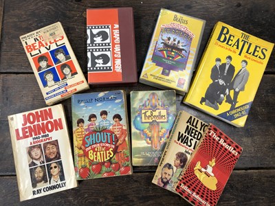 Lot 2978 - A group of Beatles books and VHS tapes; six...
