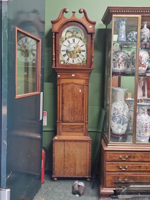 Lot 41 - A mahogany banded oak long case clock...