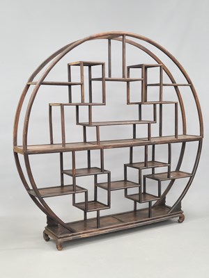 Lot 42 - A Chinese hardwood arrangement of staggered...