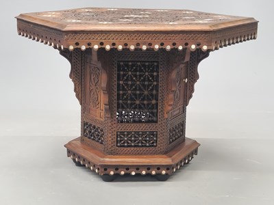 Lot 44 - An Islamic hexagonal table inlaid with mother...