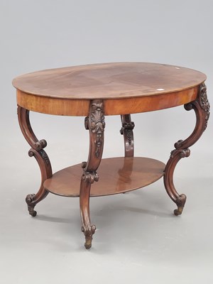 Lot 47 - A Victorian mahogany oval two tier table, the...