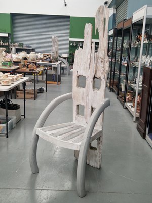 Lot 53 - A pair of drift wood backed chairs with arms...