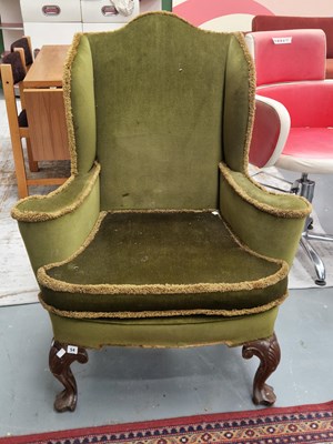 Lot 54 - A mahogany wing back armchair, the front...