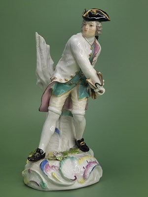 Lot 1874 - A Meissen figure of a man by a tree trunk...