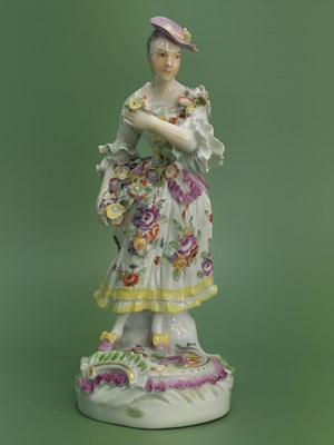 Lot 1885 - A patch mark Derby figure of a lady with a...
