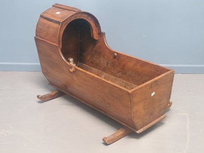 Lot 60 - A Victorian mahogany cradle on rockers, a hood...