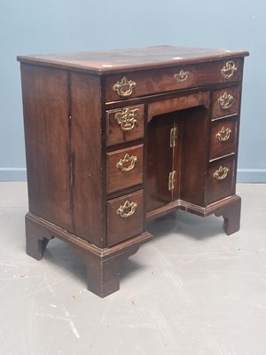 Lot 64 - A George III mahogany kneehole desk with an...