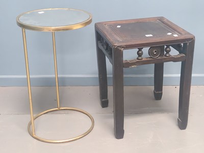 Lot 67 - A Chinese hardwood stand on four channelled...