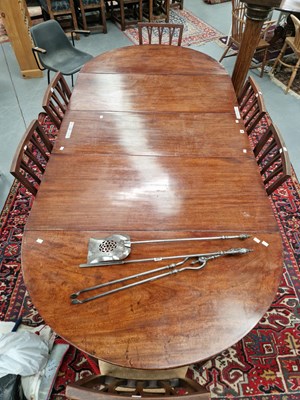 Lot 68 - A mahogany D-end dining table with central...
