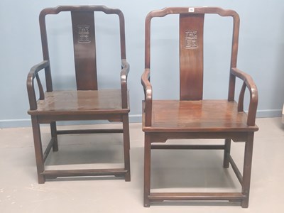 Lot 70 - A pair of Chinese hardwood elbow chairs, the...