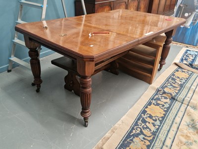 Lot 71 - An early 20th century oak dining table taking...