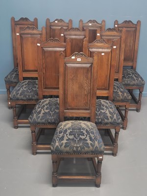 Lot 74 - A set of ten oak dining chairs, the scroll...