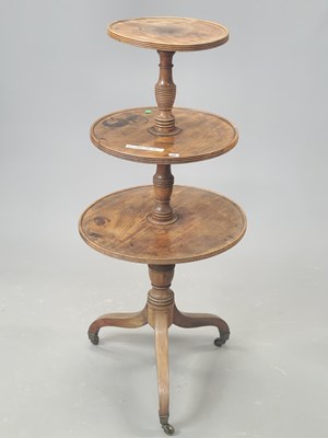Lot 86 - A late Georgian mahogany three-tier dumb...