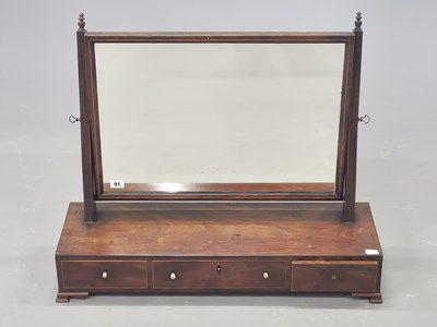 Lot 91 - A late Georgian mahogany swing toilet mirror...
